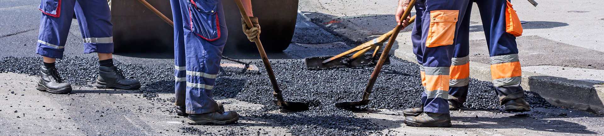 team of workers during asphalt patching repair