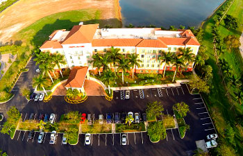 well-maintained parking lot in front of a hotel