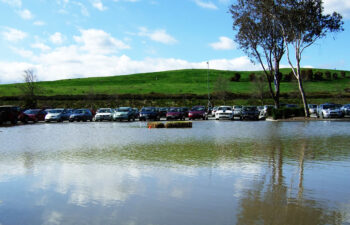 a big puddle flooding a parking lot