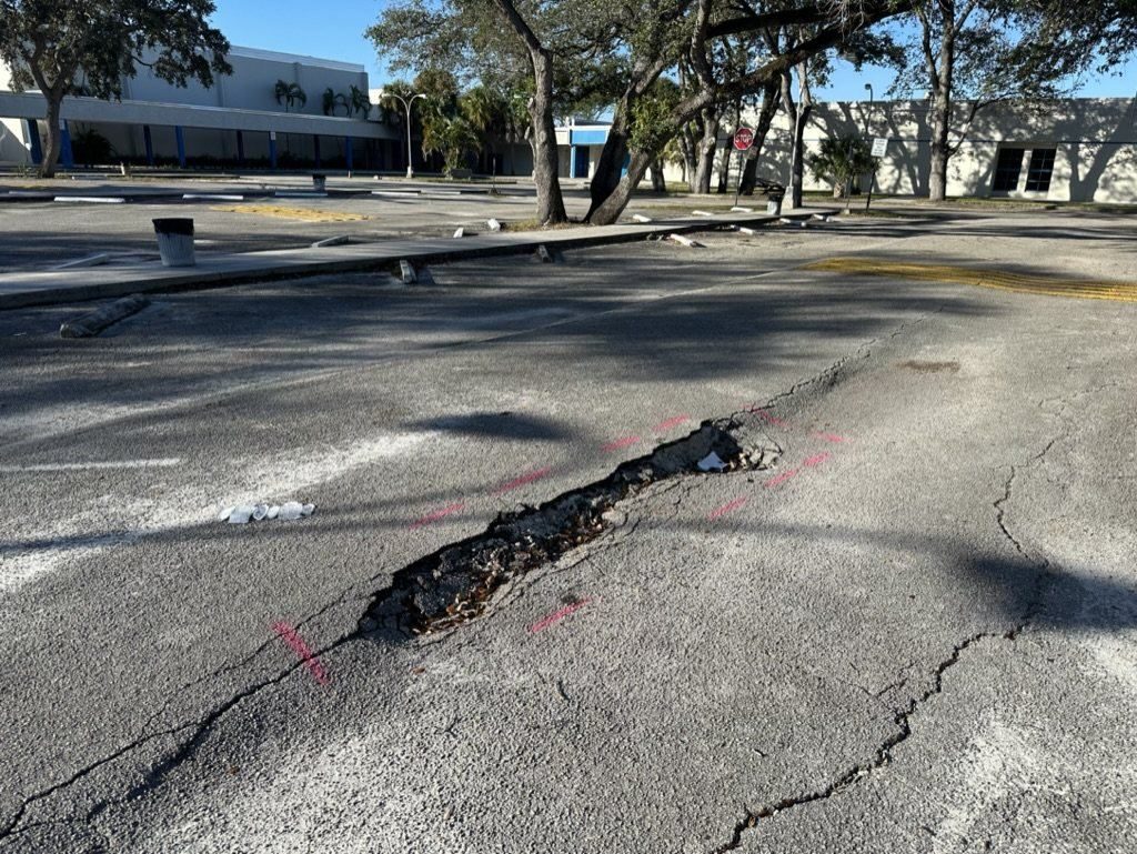 Failed pavement marked for removal.