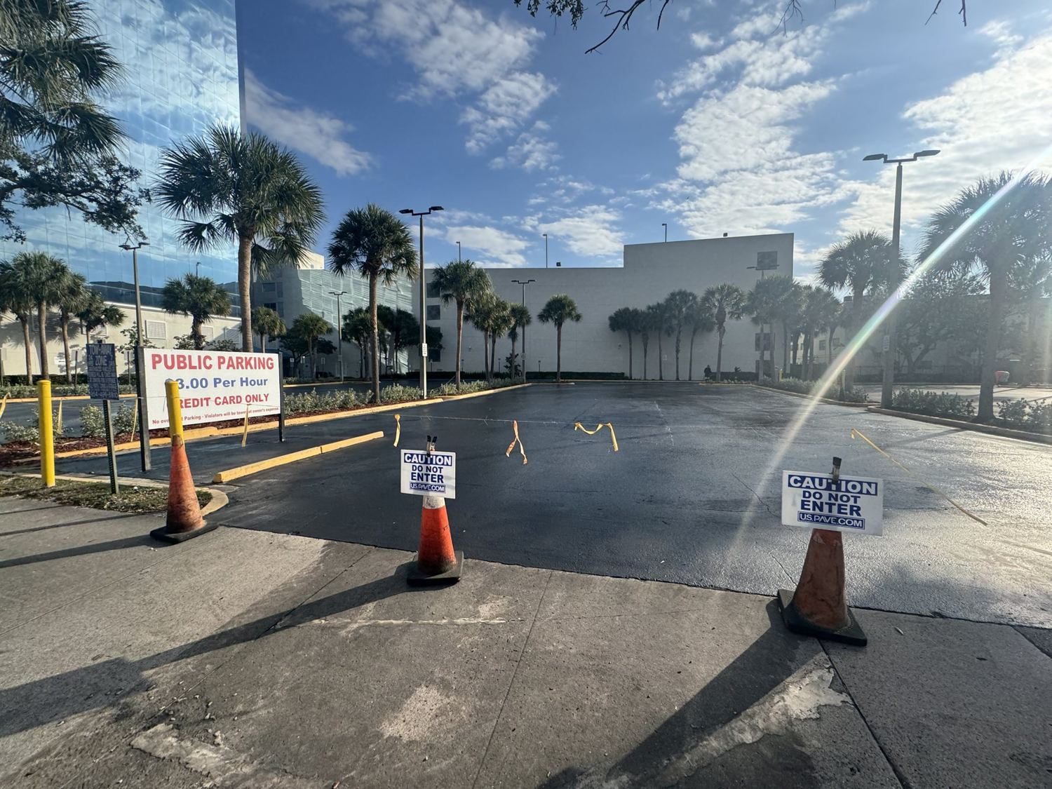 Sections closed with U.S. Pave courtesy signage so the pay lot stayed open.