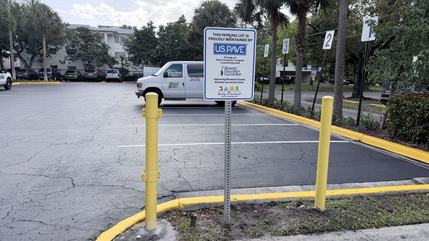 Program sign at a district lot.