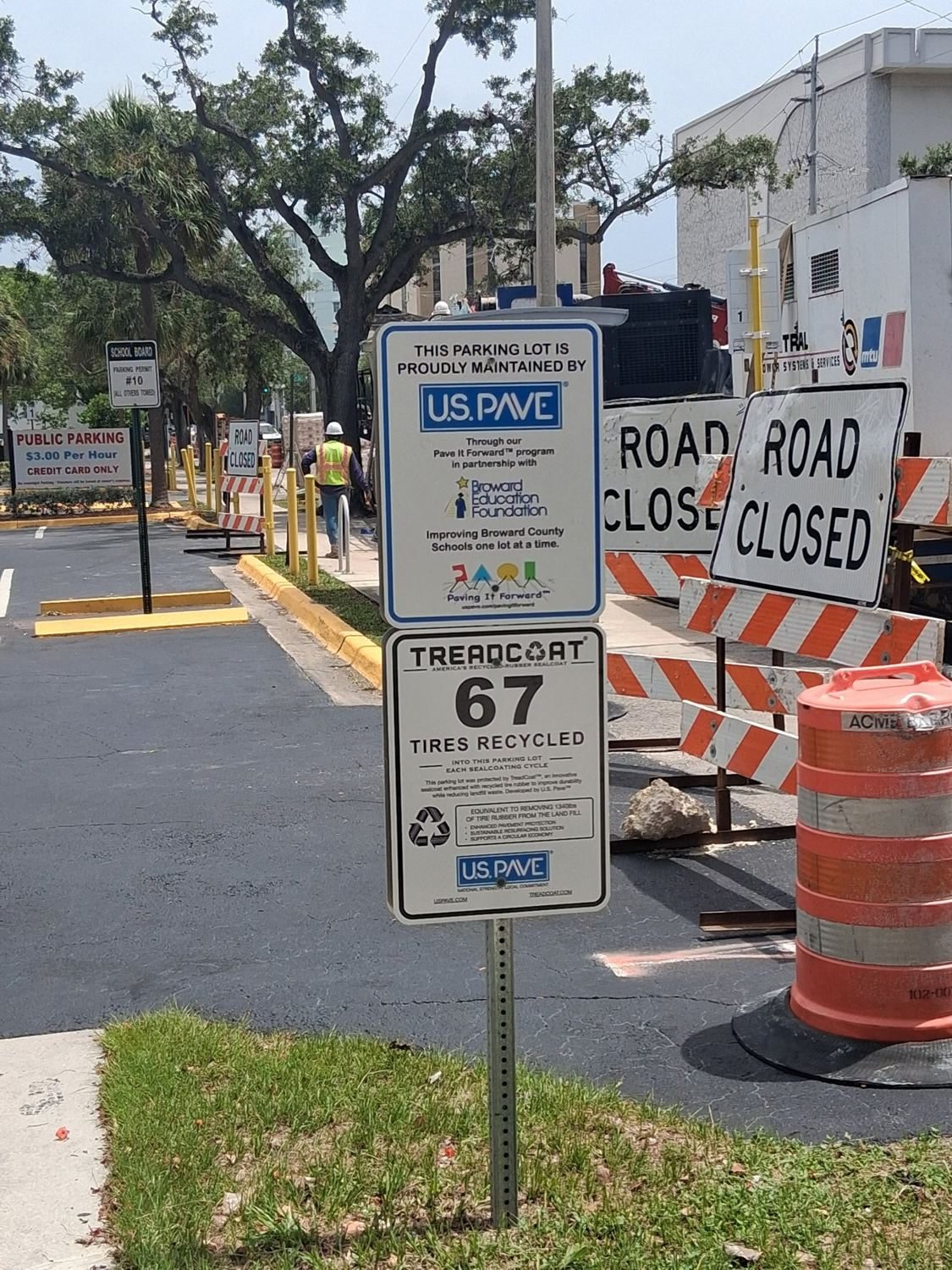 Pave It Forward and TreadCoat signs at the K.C. Wright Administration Center
