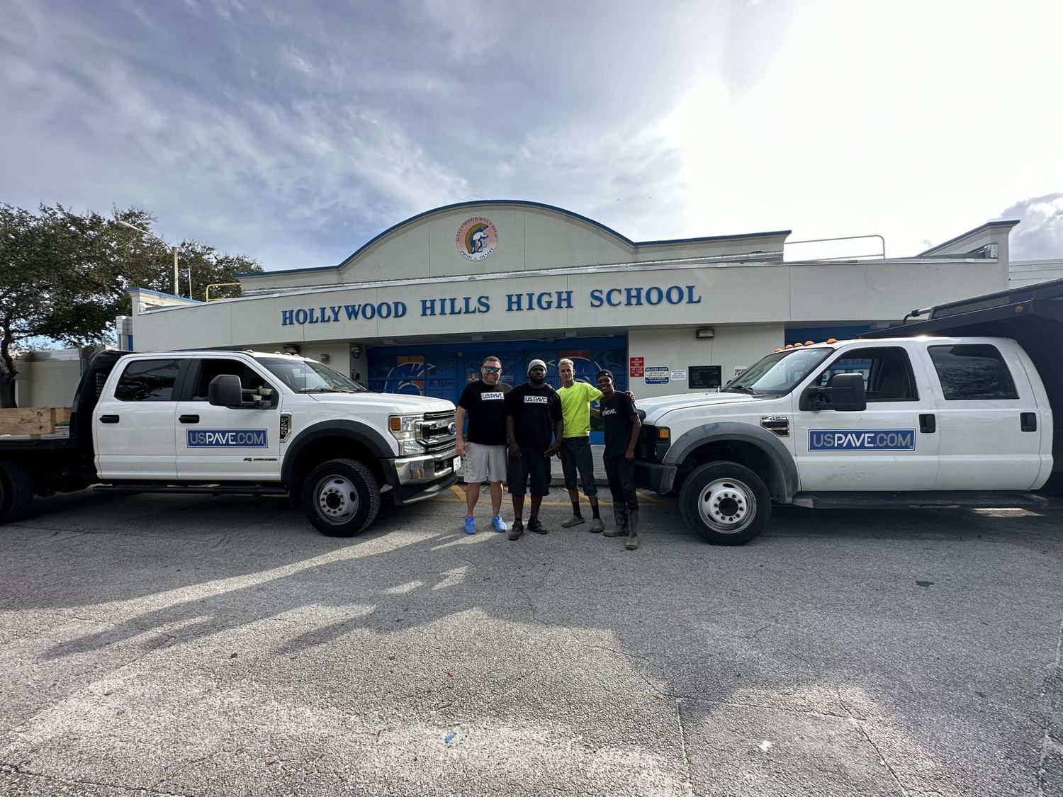 U.S. Pave crew and trucks at the Hollywood Hills High School front entrance.